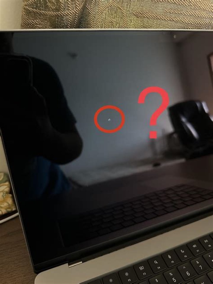 How do I fix a stuck white screen on my MacBook pro?