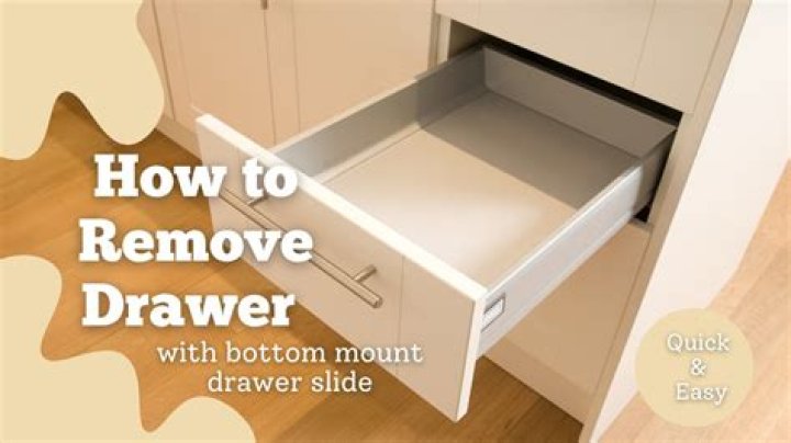 How do you remove a drawer from a kitchen cabinet?