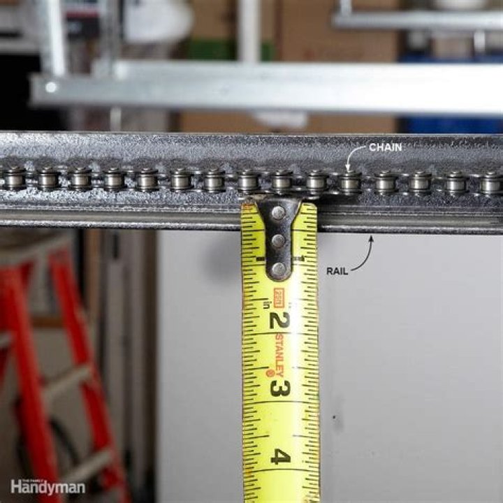 How much slack should be in garage door chain?