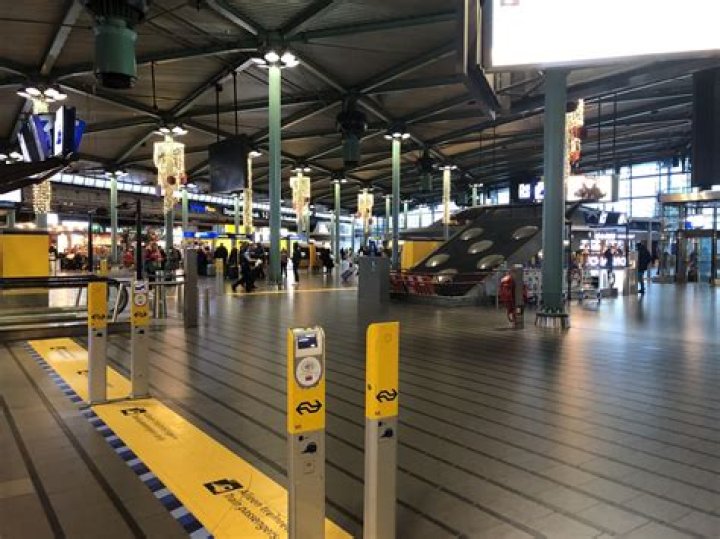 What is the train station at Schiphol Airport?