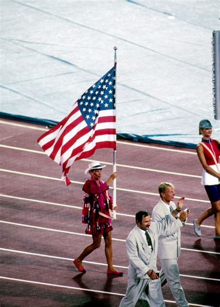 Who carried the Olympic flag 2012?